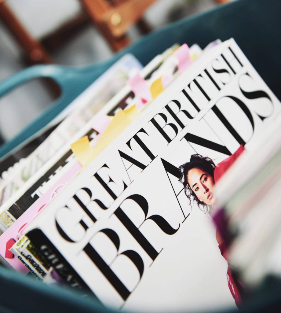 a stack of glossy magazines