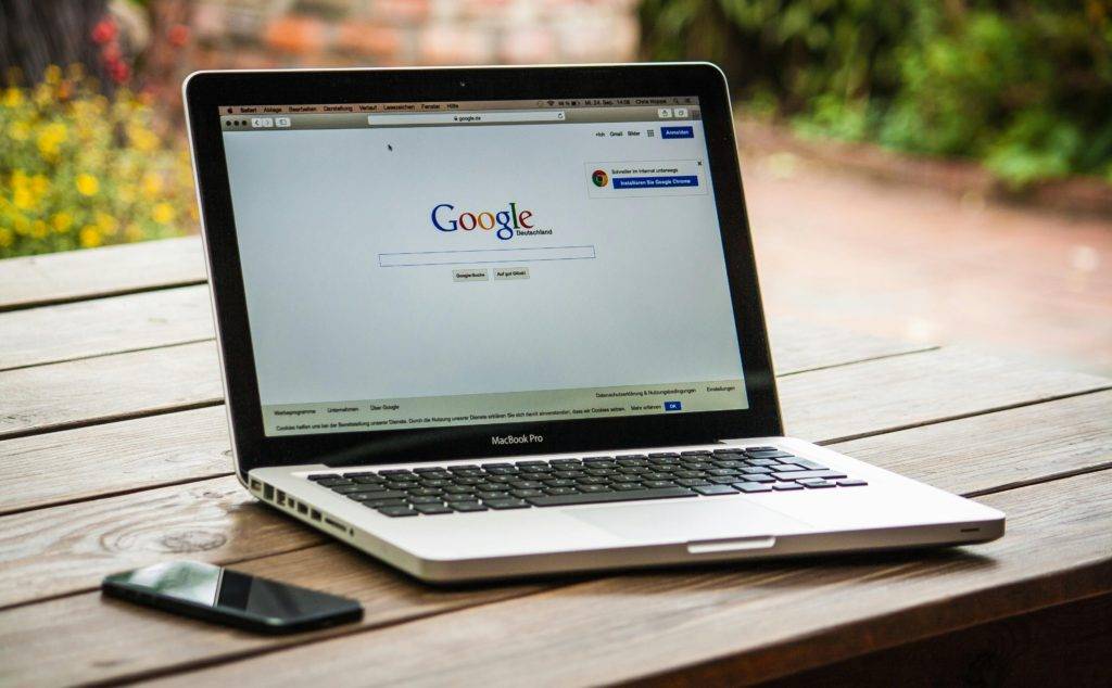 a laptop on a table with google open