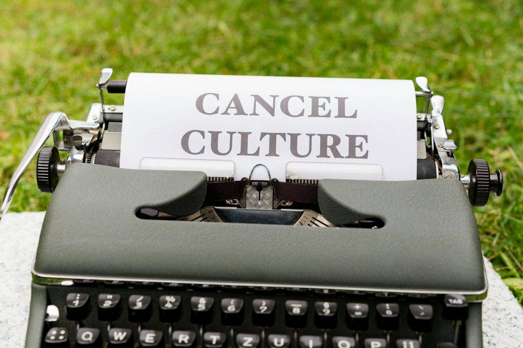A typewriter with a piece of paper reading "CANCEL CULTURE"