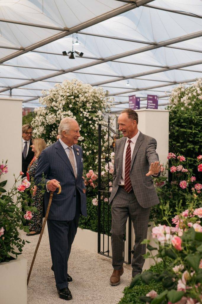 His Majesty King Charles III with David Austin Junior on the David Austin Roses stand at RHS Chelsea Flower Show