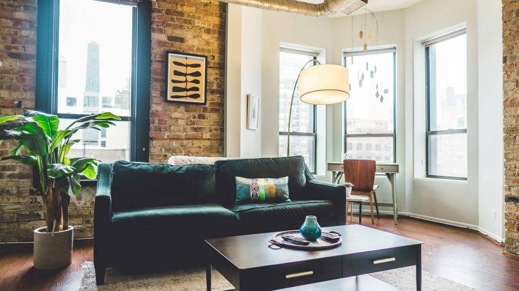 Honest Communications has launched the Home and Garden Trends Report 2026. The image shows a stylish living room with green sofa.